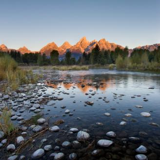 Schwabacher’s Landing during sunrise is truly a breathtaking scene. After a short walk along the Snake River the landscape opened up to this beautiful view of the sun lit peaks of Grand Teton. The morning was very cool and still, and we could hear the elk bugling in the distance.