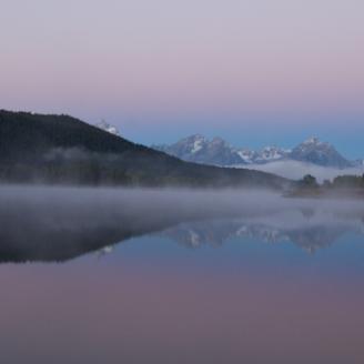 The sky takes on a purple glow shortly before the sun rises at Oxbow Bend. I think the glowing mist makes this scene take on a somewhat unreal look. It was a beautiful morning. 