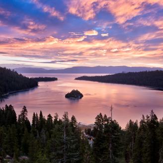 The sun rises dramatically over Emerald Bay in Lake Tahoe creating clouds that reminded me of cotton candy amidst a deep blue sky. 